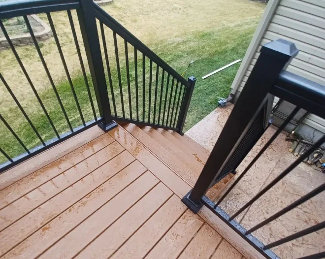 a newly installed deck with stylish railings